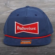 Vintage Budweiser Beer Patch on a Richardson 256 Umpqua Snapback Hat Shape Flip-Up Stay Pinch Fabric Cotton/Nylon Visor Flat Sweatband Cotton Material 70% Cotton, 30% Polyester Construction Woven Adjustable Snapback OSFM (7 - 7 3/4) Hats are shipped in a poly bag and placed in a box to protect the hat. Budweiser Hat, Merchandise Ideas, Beer Hat, Americana Aesthetic, Feed Store, Vintage Budweiser, July Outfits, Budweiser Beer, Dior Earrings