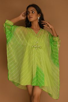 Lime green kaftan-style dress with all-over stripes, embroidered neckline and asymmetric hem.
Component: 1
Printed, Embroidered
Neckline: V-Neck
Sleeve Length: Three Quarter
Fabric: Georgette
Color: Green
Embroidery at the waist and cuffs
Asymmetric hem
Note: The inner slip worn by the model is not for sale - Aza Fashions Kaftan Style Dresses, Green Embroidery, Kaftan Style, Asymmetric Dress, Embroidered Neckline, Fashion App, Not For Sale, Green Fabric, Asymmetrical Dress