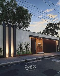 an architectural rendering of a modern house with lights on the front door and side entrance