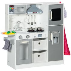 a toy kitchen with white and gray appliances