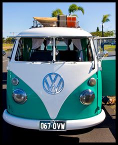 the vw bus is parked on the side of the road