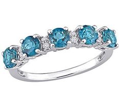 Eternity doesn't seem so long when you're wearing this gorgeous ring. Pairs of small round white topaz separate larger vibrant gemstones to highlight their color and give this ring endless appeal. Blue Topaz Ring With Cubic Zirconia Gemstone Accents, Luxury Blue Topaz Sterling Silver Ring, Blue Diamond-cut Topaz Ring In Sterling Silver, Blue Multi-stone Turquoise Ring In Sterling Silver, Luxury Sapphire-colored Topaz Ring In Sterling Silver, Gorgeous Ring, Topaz Gemstone, Ring Size Guide, Topaz Ring