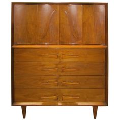 a large wooden dresser with drawers on it