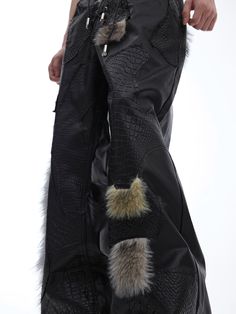 a person in black pants with some fur on them