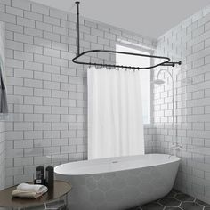 a white bath tub sitting next to a window