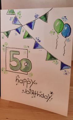 a birthday card with the number fifty five on it, and balloons in the background