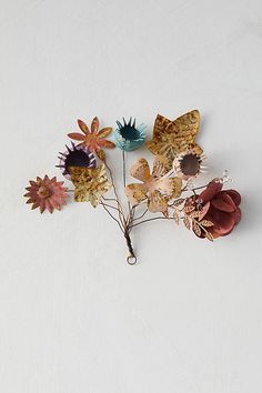 a bunch of flowers sitting on top of a white table