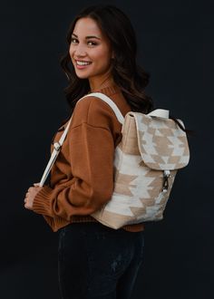 Tan and cream Aztec inspired backpack Clasp closure on the front Adjustable straps and handle Measures 14" x 11.5" x 4.5" 100% Cotton Lining: 100% Polyester Luxurious Backpack, Aztec Backpack, Backpack Collection, Ladies Backpack, Flannel Blouse, Blouses Vintage, Functional Backpack, Layered Rings, Daily Rituals