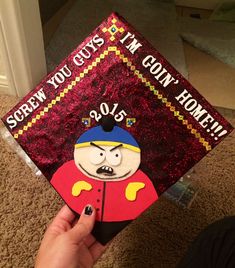 someone holding up a graduation cap that says, screw you guys i'm own home