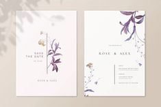 two wedding cards with purple flowers and greenery on the front, one in white