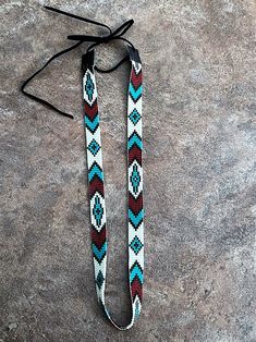 a pair of lanyards that are sitting on the ground