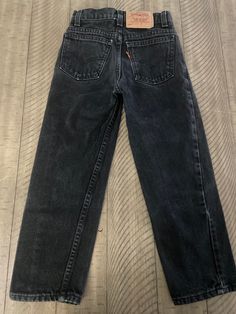 "Vintage black denim Levi's 550s child size 7 made in USA - True vintage please pay attention to measurements waist 10 1/4\"/ rise 8 1/2\" / inseam 19\" / length (waist to bottom w) 27\"/ smoke free home / no hem drag / No issues (158)" Vintage Black Jeans With Pockets, Vintage Black Jeans For Streetwear, Black Vintage Jeans For Streetwear, Black Full-length Retro Jeans, Vintage Black Denim Bottoms, Black Retro Jeans For Fall, Levi’s 550, Black Levis Outfit, Levi Jeans Outfit