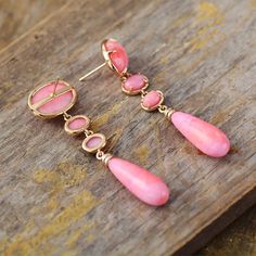 Get the Charming Bohemian beauty inspired by Nature with our new " Lilly Pink Dangle Earrings", Hand made with Semi precious Natural stones with Fancy pink Colors   Features & Specifications Material : Semiprecious Stone, Metal Making Technics : Full Handmade Size : Around 5.5-6cm Product condition : 100% New and Exquisite Quality. Pink Teardrop Chandelier Earrings For Gift, Pink Teardrop Earrings With Natural Stones, Pink Chandelier Drop Earrings For Gift, Pink Long Drop Earrings As Gift, Handmade Elegant Pink Opal Jewelry, Elegant Handmade Pink Opal Jewelry, Pink Bohemian Jewelry With Ear Wire, Bohemian Pink Earrings For Pierced Ears, Pink Teardrop Chandelier Earrings