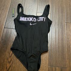 Black Nike Swimsuit With Mexico City Printed On The Front. Awesome Swimsuit, But Didn’t Fit Quite Right. Brand New With The Liner Still Intact. Nike Swimsuit, Nike Swim, Black Nike, City Prints, Swim Suit, Nike Black, Mexico City, Black Nikes, Womens Swim