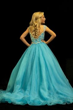 Sugar Kayne C146 Girls Pageant Dress. This lush pageant ballgown is made of flowy organza fabric. The top is embellished with semi sweetheart neckline and cap sleeves. Float on the stage in this full flowy pageant ballgown for girls and preteens. Colors: Turquoise, Orange Sizes: 2-16 (Sizes 2-6 do not have bust cups, Sizes 8-16 will have preteen size bust cups) Fabric: Organza, Mesh, Stretch Lining Johnathan Kayne, Girls Pageant Dresses, Unique Prom Dresses, Beaded Bodice, Pageant Dress, Orange And Turquoise, Organza Fabric, The Stage, Stunning Dresses