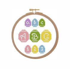 a cross stitch pattern with numbers and symbols on it