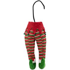 a red and green striped christmas stocking hanging from a hook