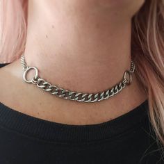 Super trendy punk style chunky chain choker necklace in silver! Thick curb chain and O ring choker necklace. Chunky yet lightweight and super comfortable to wear! Made of stainless steel so will not tarnish or discolour. Available in 2 sizes: Small: ( shown in photographs) measures 12.5 inches and comes with a 3 inch extension chain  Medium: Measures 14.5 inches and comes with a 3 inch extension chain  Please note this necklace is best worn as a tight fit. Please don't hesitate to contact me with any queries or suggestions ☺️ 💕 You will receive this necklace gift wrapped ready to give as a gift to someone special or as a special treat for yourself! 💕 Chunky Chain Stainless Steel Jewelry For Streetwear, Punk Metal Chunky Chain Jewelry, Punk Stainless Steel Choker Jewelry, Punk Style Link Chain Jewelry, Trendy Clavicle Chain Jewelry For Streetwear, Punk Link Chain Jewelry, Metal Curb Chain Necklace For Streetwear, Metal Curb Chain Jewelry For Streetwear, Punk Stainless Steel Choker