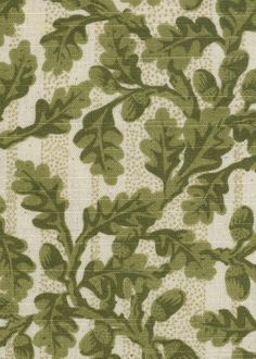 a green and white fabric with leaves on it