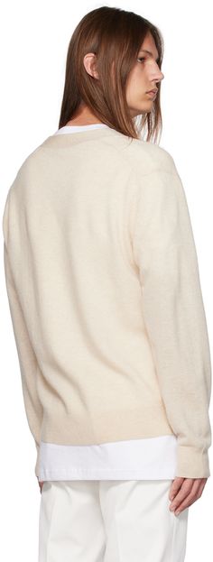 Lightweight knit RWS-certified wool cardigan. · Rib knit Y-neck, hem, and cuffs · Button closure · Embroidered logo patch at chest Supplier color: Oatmeal melange Beige Wool Cardigan With Ribbed Cuffs, Beige Cashmere Cardigan With Ribbed Cuffs, Cream Long Sleeve Cashmere V-neck Sweater, Cream Wool Cardigan With Ribbed Cuffs, Cozy Cream Cardigan With Ribbed Cuffs, Cream Crew Neck Cardigan With Ribbed Cuffs, Patch Cardigan, Acne Shop, Beige Cardigan