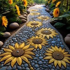 a pathway made out of stones with sunflowers painted on it