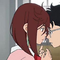 two anime characters are kissing each other