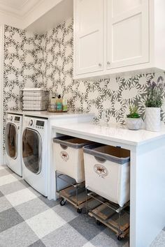 an image of a laundry room with white cabinets