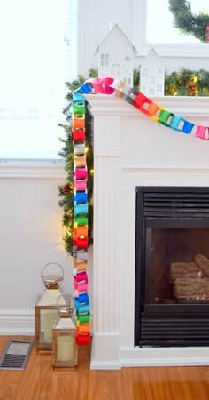 a decorated fireplace in a living room next to a christmas tree