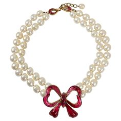 This authentic Chanel Double Pearl Red Gripoix Bow Choker is in excellent vintage condition from the 1970’s. Double strand of large faux pearls is anchored with a substantial red bow made in Gripoix glass. Pouch or box included. PBF 13802 Red Jewerly, Chanel Choker, Red Pearl Necklace, Chanel Clothes, Vintage Chanel Jewelry, Coquette Jewelry, Bow Choker, Chanel Pearl, Accessories Aesthetic