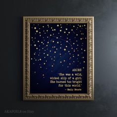 the stars in the night sky are lit up with gold and blue lettering on it