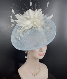 This gorgeous sinamay fascinator hat, made of Sinamay, forming a disc shape, seated on a same color  satin headband, Embellished with a large hand made  goose feather fowers If you want to change the sinamay base hat or feather flower color to match your dress, please let me know Great for events such as a wedding, race meetings such as Royal Ascot, Cheltenham, Ebor, Goodwood, Melbourne Cup, Kentucky Derby or any hat wearing occasion. 💃1. All hats will be sent from Rockville, MD, 20850, using F White Sinamay Mini Hats For Spring, Spring White Mini Hats In Sinamay, Elegant Sinamay Fascinator For Spring, White Sinamay Fascinator For Royal Ascot, White Sinamay Fascinator For Races, Spring White Sinamay Mini Hats, Blue Feathered Hat For Races, Elegant Light Blue Fascinator For Races, Blue Fitted Sinamay Fascinator