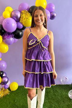 Unleash your game day chic with this purple tiered dress! Featuring bright yellow ric rac trim, adjustable spaghetti straps, and a bust-tying design, this dress is both cute and practical. Perfect for cheering on your team in style. Ecu Pirates, Denim Jewelry, Peach Love, Ric Rac, New Arrival Dress, Tiered Dress, Bright Yellow, Purple Dress, Sales Gifts