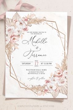 an elegant wedding card with pink flowers and gold foil on the front, is shown