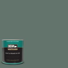 the behr ultra paint is shown in an open gray tin with purple and white accents