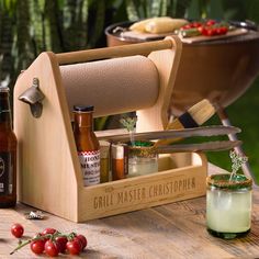 a wooden box filled with different types of food and condiments on top of a table