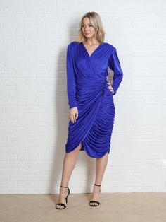 "Vintage 80s Blue Draped Dress - Zips up the back - Plunging V neckline -Measurements- Estimated Size: Small Bust: 34-35\" Waist : 26\" Hips: 38\" Length: 40\" Sleeve: 25\" Model is 5'9 and measures 32/25/34" Blue Midi Dress With Surplice Neckline For Evening, Blue Surplice Neckline Midi Dress For Evening, Blue Midi Dress With Surplice Neckline For Parties, Blue Surplice Neckline Midi Dress For Party, Blue Dress With Surplice Neckline For Evening, Blue Evening Dress With Surplice Neckline, Blue Draped Midi Dress For Party, Blue Draped Dinner Dress, Blue Draped Dress For Dinner