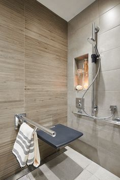 a towel rack in a bathroom next to a shower