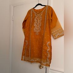 Brand New Unworn Dupatta Has Sequence Work As Well As The Kameez Pants Are Plain Orange Lawn Suit With Dabka For Diwali, Spring Festive Orange Kurta, Orange Long Sleeve Sets With Dabka Work, Traditional Orange Lawn Suit For Summer, Fitted Orange Kurta For Summer, Traditional Orange Sets For Spring, Elegant Festive Orange Lawn Suit, Elegant Fitted Orange Kurta, Orange Summer Lawn Suit