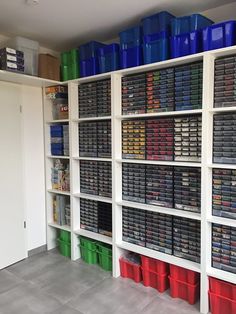 a room filled with lots of different colored bins