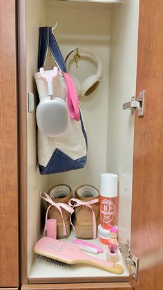 the inside of a bathroom cabinet filled with personal care items