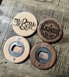 three wooden bottle openers sitting on top of a table