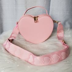 -Super Cute Baby Pink Heart Crossbody Bag -Has A Cardholder Slot Inside Main Compartment -Comes With Adjustable/Detachable Cotton Heart Guitar Crossbody Strap And Has Top Handbag Handle -Bag Can Be Worn As A Crossbody Bag, Shoulder Bag, Or As A Handbag -All Gold Hardware Accents -Zipper Closure -New With Tags. No Damages Dimensions: W:8" H:7" D:4" Pink Heart-shaped Bag For Valentine's Day, Cute Pink Satchel With Adjustable Strap, Cute Shoulder Bag For Valentine's Day, Cute Valentine's Day Crossbody Shoulder Bag, Pink Crossbody Shoulder Bag Gift, Cute Crossbody Satchel Gift, Pink Heart-shaped Shoulder Bag For Daily Use, Cute Heart-shaped Shoulder Bag For Daily Use, Trendy Heart-shaped Mobile Phone Bag