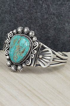 This beautiful turquoise and sterling silver bracelet was made by Navajo silversmith Jess Martinez. The inside is signed and stamped sterling.Size: 5 1/2" (will fit up to a 6 1/2" wrist)Gap: 1"Width: 1 5/8"Free shipping on all orders! We ship with USPS and always include tracking. All orders ship within a day of payment.Returns are accepted up to 30 days after you receive your order. Just send us a message. Our shop offers cash back or store credit. The item must be returned in new condition. Stamped Turquoise Sterling Silver Bracelet, Stamped Sterling Silver Bracelet In Turquoise, Sterling Silver Turquoise Stamped Bracelet, Southwestern Style Turquoise Bracelet Stamped 925, Southwestern Style Turquoise Stamped Bracelets, Turquoise Southwestern Cuff Bracelet Stamped 925, Vintage Turquoise Sterling Silver Bracelets, Southwestern Turquoise Cuff Bracelet Stamped 925, Southwestern Turquoise Sterling Silver Cuff Bracelet