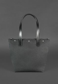 Introducing our premium woven leather tote bag designed for the modern businesswoman. This sophisticated handbag blends style and functionality, making it the perfect accessory for carrying your essentials. Key Features: Spacious Interior: Despite its compact size, it accommodates a laptop, document folder, and other essentials. Organized Storage: Features one large compartment, a dedicated laptop pocket with a strap and button closure, and two patch pockets. Secure Closure: Equipped with a stur Modern Bucket Bag With Detachable Handle For Business, Modern Business Bucket Bag With Detachable Handle, Office Shoulder Bag With Coated Canvas And Handle Drop, Elegant Coated Canvas Bags For Everyday Use, Modern Business Bags With Handles, Modern Business Shoulder Bag, Modern Bucket Bag With Leather Handles For Office, Modern Bucket Bag With Handles, Elegant Coated Canvas Shoulder Bag For Everyday Use