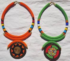 100% handcrafted using fine beads. Bright colors that will make you stand out from the rest. *This listing is for 5 necklaces. All different colors. Dimensions; 19 inches around the neck, 4 inch pendant. The closure is an S shape clasp. **Buy multiple items and pay shipping for 1 item only. More neckleces here; https://www.etsy.com/shop/TribalTess?ref=seller-platform-mcnav&section_id=21306083 Back to my shop; https://www.etsy.com/shop/TribalTess?ref=seller-platform-mcnav Handmade Round Beaded Necklace For Festivals, Green Beaded Chain Necklace For Festivals, Colorful Beaded Green Necklace For Festivals, Green Necklace With Colorful Beads For Festivals, Colorful Beads Round Necklace For Festivals, Festival Colorful Beaded Round Necklaces, Unique Pendant Beaded Necklace, Festive Colorful Beads Round Necklaces, Unique Long Beaded Necklace