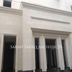 an empty building with columns and windows on the outside, in front of it is a sign that says sarah sadq architectures