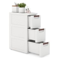 three white drawers with plants on top and one planter in the bottom, against a white background