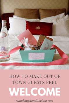 a bed with a bottle of water and some cards on it that says, how to make out of town guests feel welcome