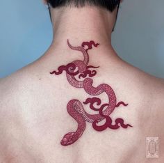 a man with a tattoo on his back