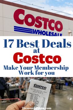 a person holding up a piece of paper in front of a costco store